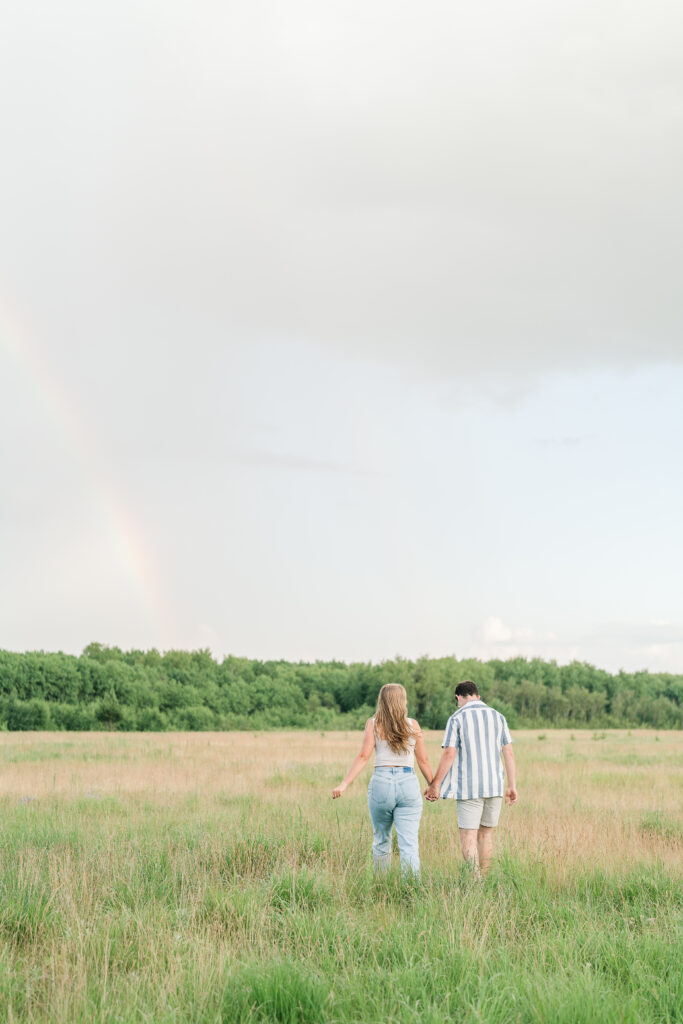 Couple photoshoot with rainbow in Manitoba