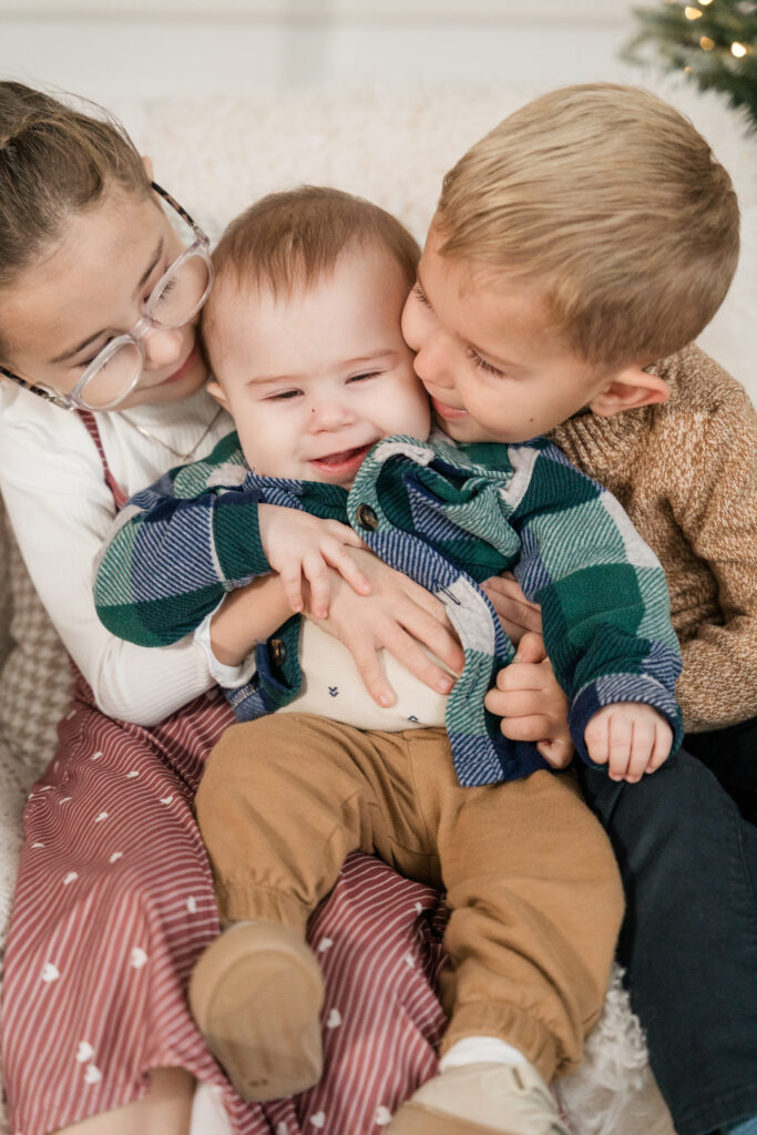 Winnipeg family photographer - kids hugging during family shoot